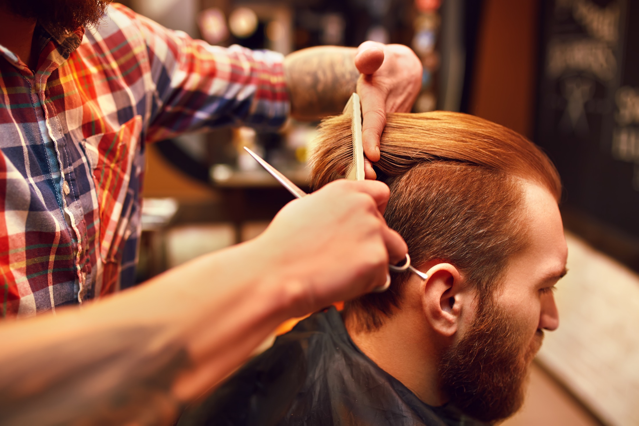 Close haircut detail with scissors and comb